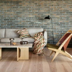 Røros Tweed - Ida Wollen Deken 23 Røros Tweed - Ida Wollen Deken -CONNOX Winkel Roros Tweed Ida Kissen 50 50 cm olive burgundy Decke Couch Ambiente 1